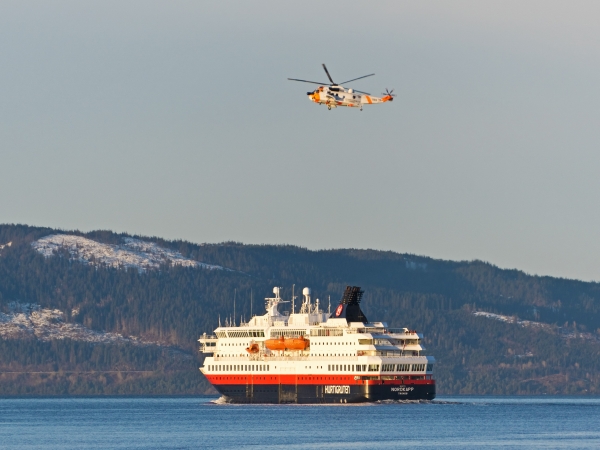 MS Nordkapp and a helicopter on their mission