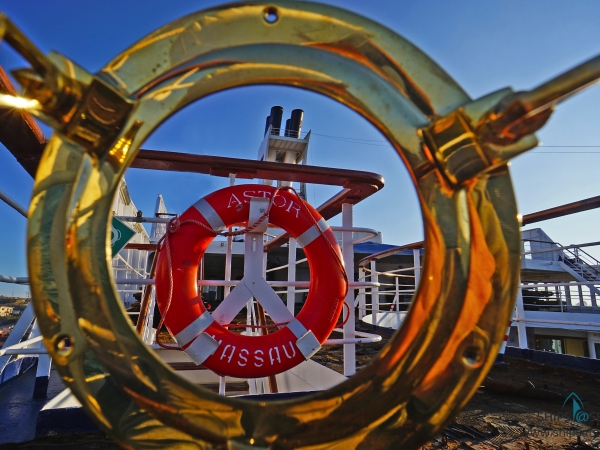 Portholes view: MS ASTOR lifebuoy and funnel from Brückendeck