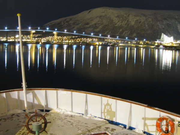 MS Nordstjernen of Hurtigruten together with the Tromso-scenery
