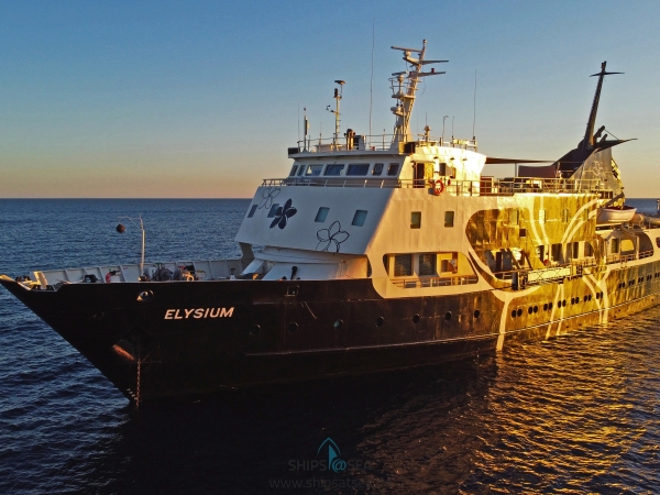 MS Elysium anchoring in the setting sun