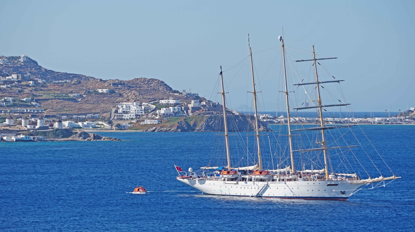 SPV Star Flyer of Star Clippers Cruises at anchor at the Mykonos windmills